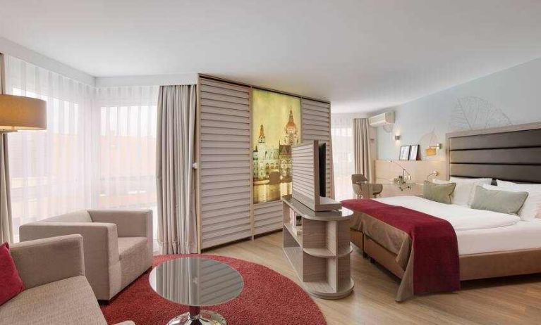 Stylish king suite with working station at the DoubleTree by Hilton Hannover Schweizerhof.