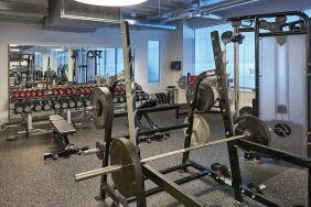 Fitness center with weights and machines at the Hilton Frankfurt City Centre.