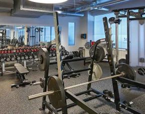 Fitness center with weights and machines at the Hilton Frankfurt City Centre.