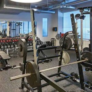 Fitness center with weights and machines at the Hilton Frankfurt City Centre.