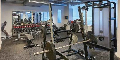 Fitness center with weights and machines at the Hilton Frankfurt City Centre.