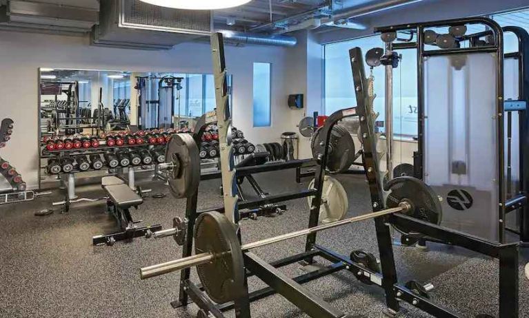 Fitness center with weights and machines at the Hilton Frankfurt City Centre.