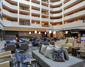 comfortable and bright-lit lounge and coworking space at Embassy Suites by Hilton Raleigh Durham Research Triangle.