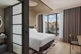 Bright balcony with desk at the Canopy by Hilton Paris Trocadero.