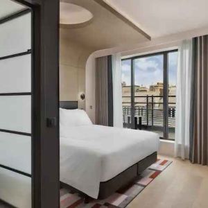 Bright balcony with desk at the Canopy by Hilton Paris Trocadero.