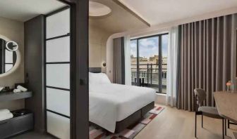 Bright balcony with desk at the Canopy by Hilton Paris Trocadero.