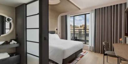 Bright balcony with desk at the Canopy by Hilton Paris Trocadero.