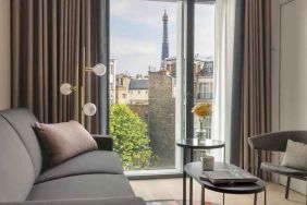 Living room overlooking the tour eiffel at the Canopy by Hilton Paris Trocadero.