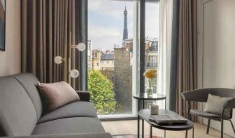 Living room overlooking the tour eiffel at the Canopy by Hilton Paris Trocadero.