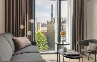 Living room overlooking the tour eiffel at the Canopy by Hilton Paris Trocadero.