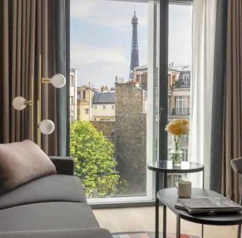 Living room overlooking the tour eiffel at the Canopy by Hilton Paris Trocadero.