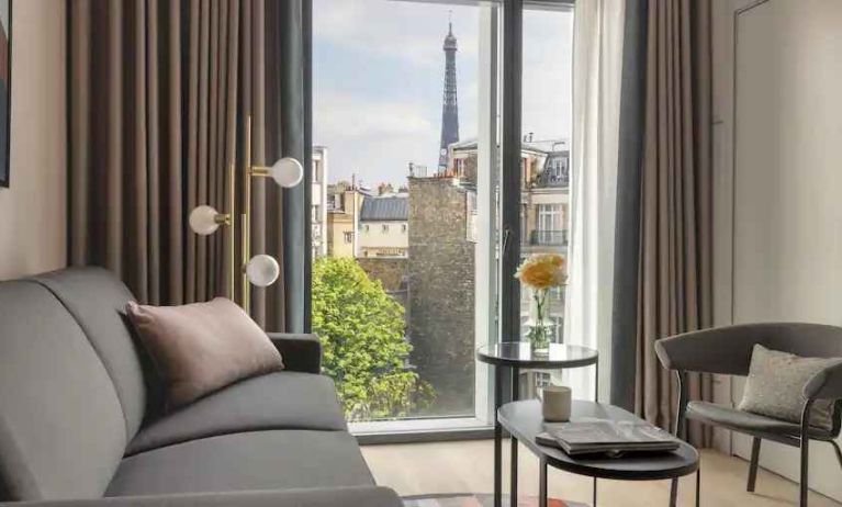 Living room overlooking the tour eiffel at the Canopy by Hilton Paris Trocadero.