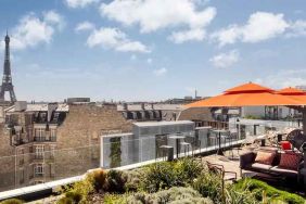 Beautiful outdoor terrace overlooking the city and the tour eiffel at the Canopy by Hilton Paris Trocadero.