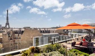 Beautiful outdoor terrace overlooking the city and the tour eiffel at the Canopy by Hilton Paris Trocadero.