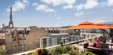 Beautiful outdoor terrace overlooking the city and the tour eiffel at the Canopy by Hilton Paris Trocadero.