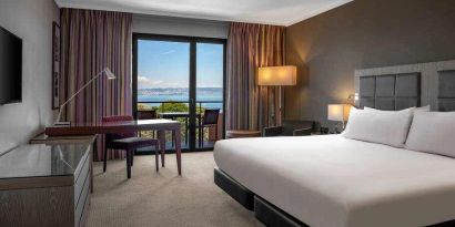 King bedroom with lake view at the Hilton Evian-les-Bains.