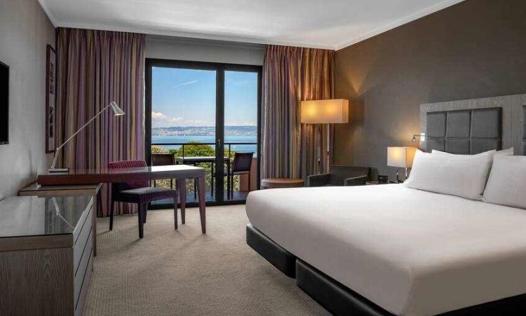 King bedroom with lake view at the Hilton Evian-les-Bains.