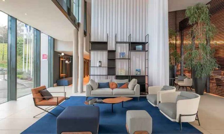 Bright lobby workspace with sofas at the Hilton Evian-les-Bains.