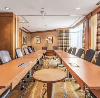 Meeting room with u shape table at the Hilton Paris Charles de Gaulle Airport.