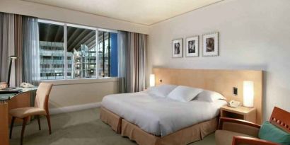 King bedroom with desk at the Hilton Paris La Defense.