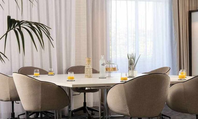 Meeting room with square table at the Hilton Garden Inn Tours Centre.