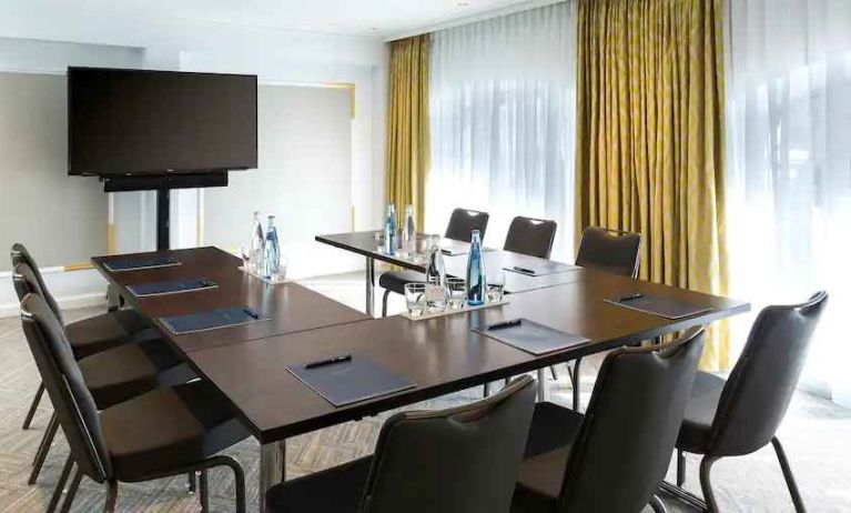 Meeting room with small u shape table at the Hilton Paris Opera.