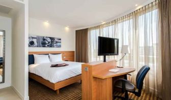 King suite with working station at the Hampton by Hilton Amsterdam Airport Schiphol.