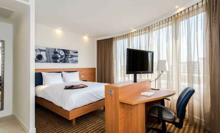 King suite with working station at the Hampton by Hilton Amsterdam Airport Schiphol.