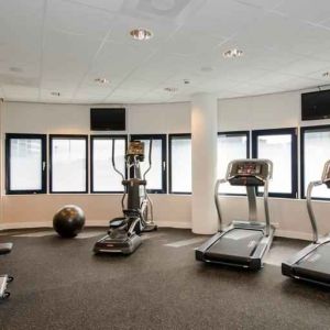 Fitness center with treadmill and machines at the Hampton by Hilton Amsterdam Airport Schiphol.