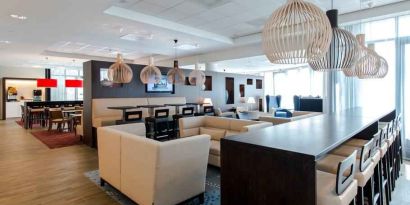 Comfortable lobby workspace at the Hampton by Hilton Amsterdam Airport Schiphol.