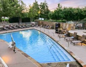 Relaxing outdoor pool at the Hilton Dallas Plano Granite Park.
