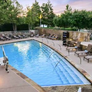 Relaxing outdoor pool at the Hilton Dallas Plano Granite Park.