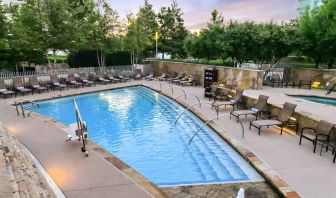 Relaxing outdoor pool at the Hilton Dallas Plano Granite Park.