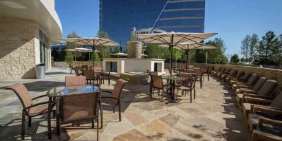 Beautiful outdoor terrace perfect as workspace at the Hilton Dallas Plano Granite Park.