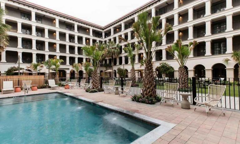 Stunning outdoor pool with pool chairs at The Modern Honolulu.