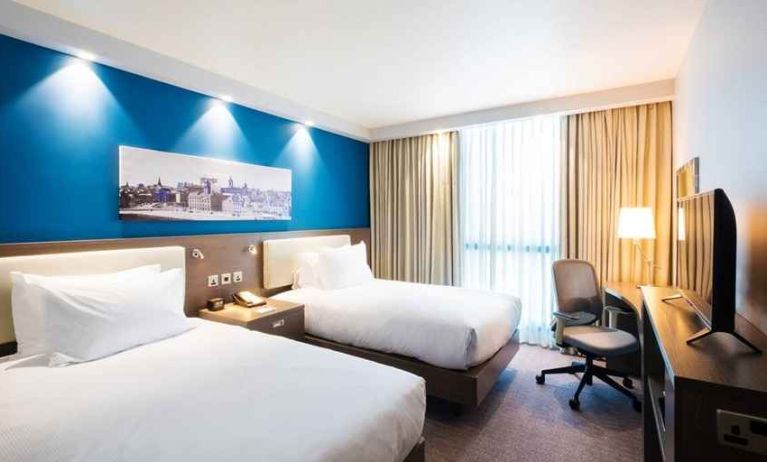 spacious twin room with work desk and TV at Hampton by Hilton Hamilton Park.