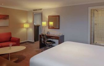 spacious king room with work desk and lounge area at DoubleTree by Hilton Bristol City Centre.