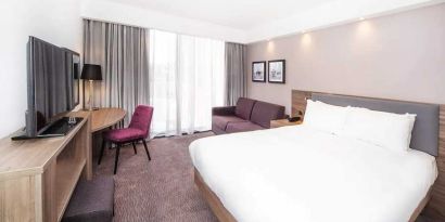 delux king bed with TV and work desk at Hampton by Hilton Blackpool.