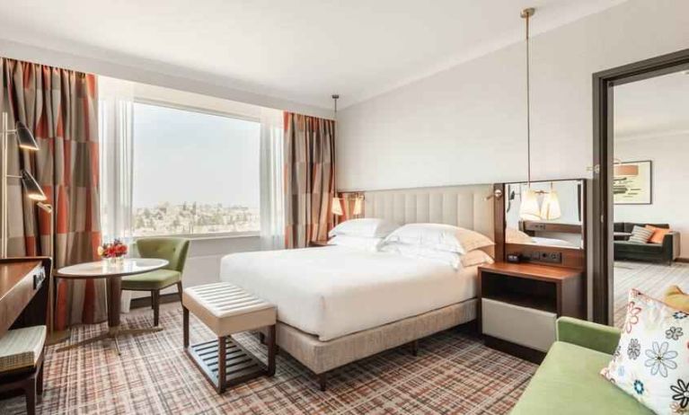 Comfortable king suite with working station at the Hilton Amsterdam.