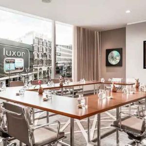 Brigh meeting room with large windows at the Hilton Rotterdam.