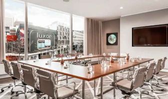 Brigh meeting room with large windows at the Hilton Rotterdam.