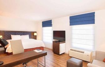 comfortable delux king room with work area ideal for working remotely at Hampton Inn & Suites by Hilton San Jose-Airport.