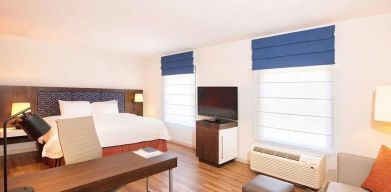 comfortable delux king room with work area ideal for working remotely at Hampton Inn & Suites by Hilton San Jose-Airport.