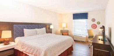 spacious king room with TV and work desk ideal to work remotely at Hampton Inn & Suites by Hilton San Jose-Airport.