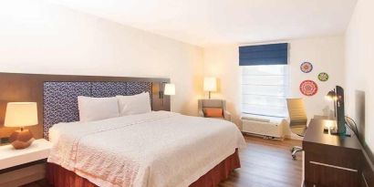 spacious king room with TV and work desk ideal to work remotely at Hampton Inn & Suites by Hilton San Jose-Airport.