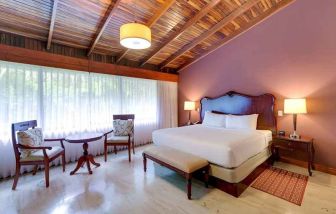 spacious king suite with dining area at DoubleTree by Hilton Hotel Cariari San Jose - Costa Rica.