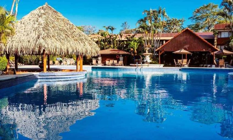 gorgeous outdoor pool with sun beds at DoubleTree by Hilton Hotel Cariari San Jose - Costa Rica.