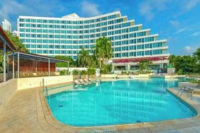 beautiful outdoor pool with sun beds at Hilton Cartagena Hotel.