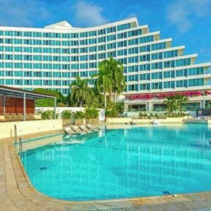 beautiful outdoor pool with sun beds at Hilton Cartagena Hotel.