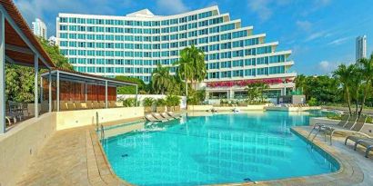 beautiful outdoor pool with sun beds at Hilton Cartagena Hotel.